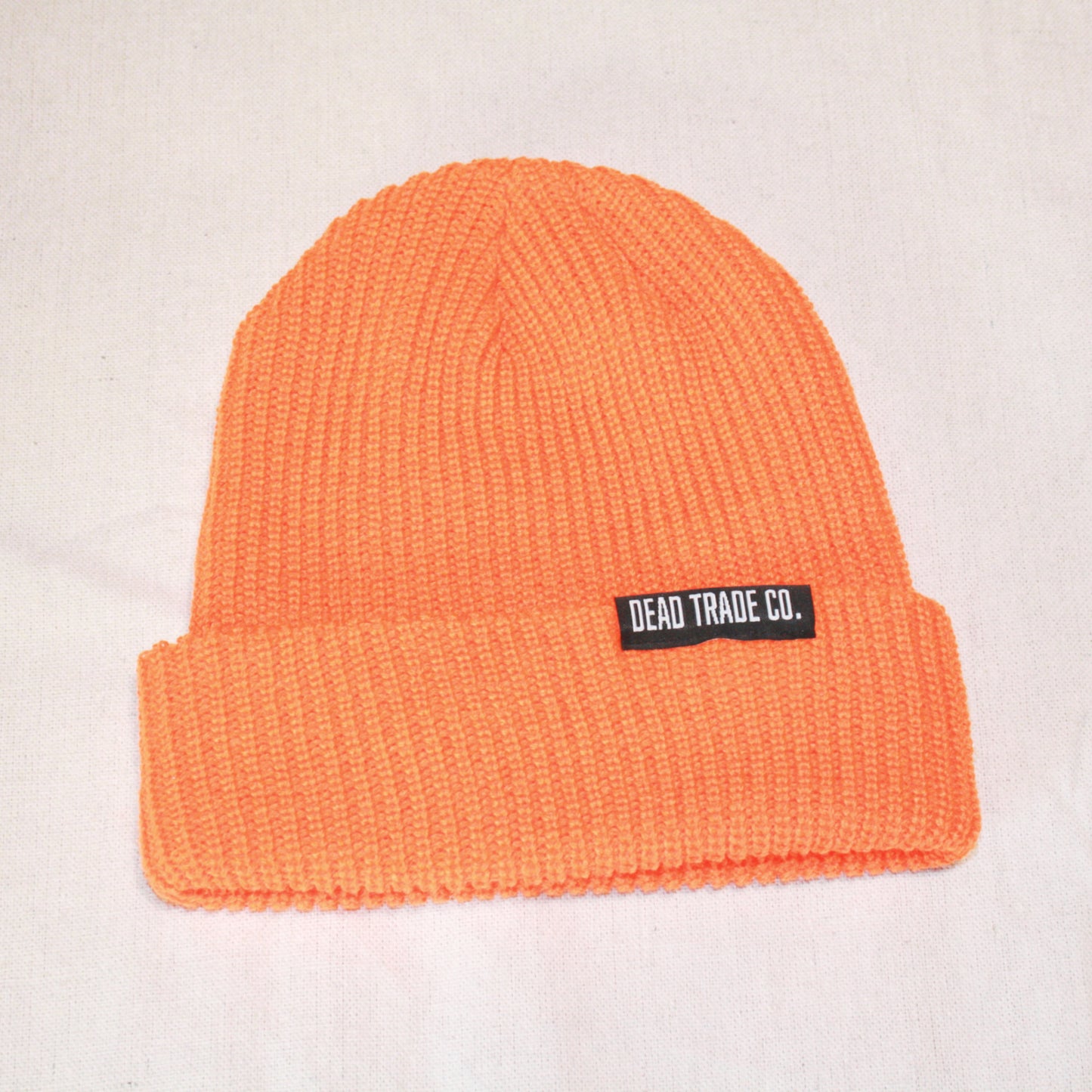 Comfortable, mid-low profile ribbed knit, made-in-Canada toque/beanie, 100% acrylic, 8" with folded cuff. Available in 6 colors. Soft, durable, with an embroidered tag on the cuff. Manufactured in Quebec, finished in Alberta, Canada.