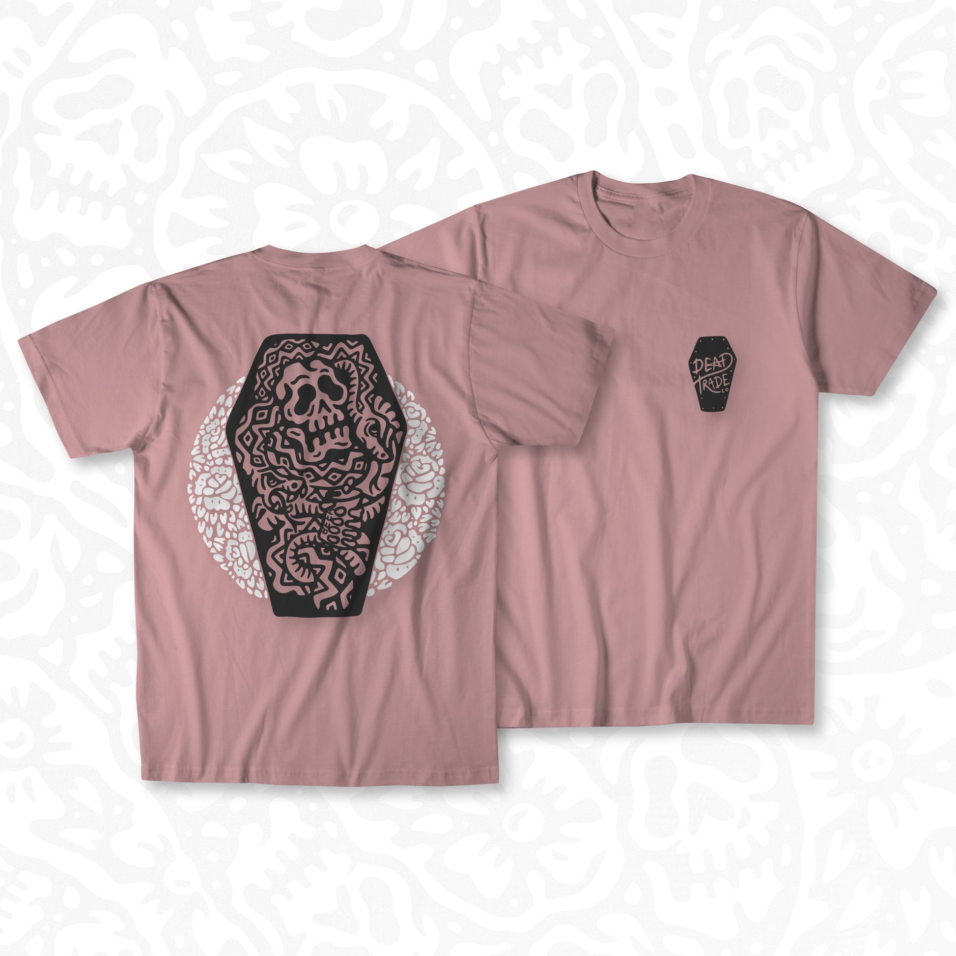 Dusty rose graphic t-shirt made in Canada from a soft 50/50 poly-cotton blend, featuring a bold hand-drawn design of a skull in a coffin surrounded by snakes and flowers, screen printed in black and white ink. Perfect for those who appreciate lowbrow, tattoo-style artwork.