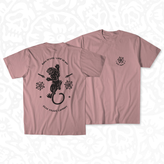 Dusty rose graphic t-shirt made in Canada from a soft 50/50 poly-cotton blend, featuring a bold hand-drawn design of a fighting panther surrounded by spears and flowers, screen printed in black ink. Perfect for those who appreciate lowbrow, traditional tattoo artwork.