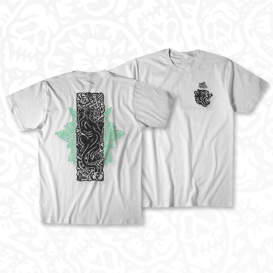 White graphic t-shirt made in Canada from a soft 100% ring-spun cotton, featuring a bold hand-drawn design of a panther on a pit of bones, screen printed in black and light green ink. Perfect for those who appreciate lowbrow, tattoo-style artwork.