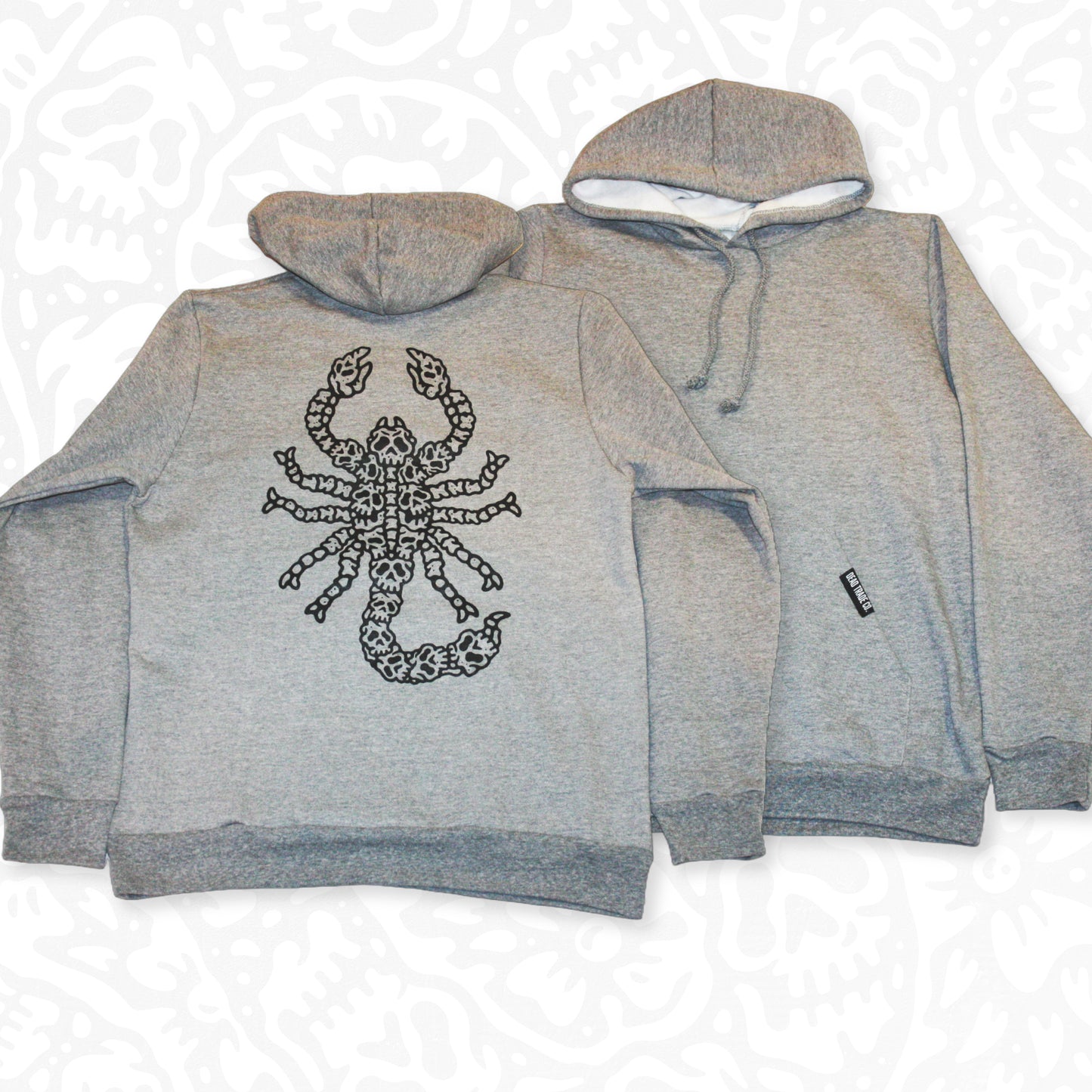 Grey colour, high-quality, made-in-Canada hoodie featuring a hand-drawn scorpion made of skulls screen printed in black on the back. Crafted with 50/50 ring-spun poly/cotton fleece, soft feel, reduced pilling, and durability. Unisex size, 14oz, perfect for cold Canadian winters.