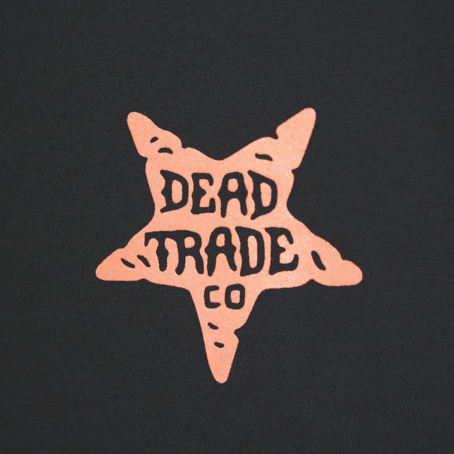 Black graphic t-shirt made in Canada from a soft 100% ring-spun cotton, featuring a bold hand-drawn design of a nasty, horned devil head, screen printed in red-orange ink. Perfect for those who appreciate lowbrow, tattoo-style artwork.