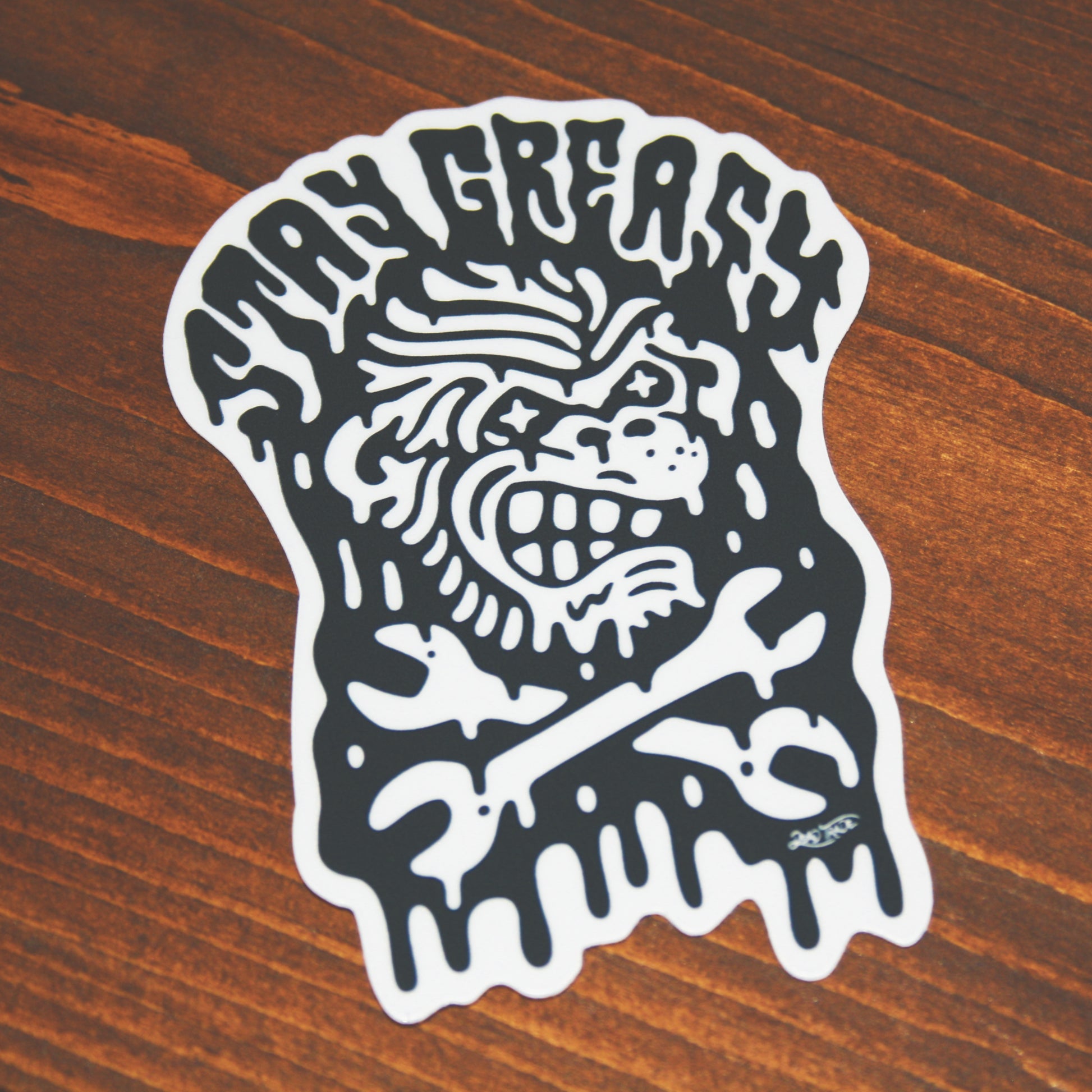 5-piece vinyl sticker pack with hand-drawn designs: rose & dagger, screw head, scatterbrain, grease monkey, and zombie in a coffin. Durable, matte finish, weather-resistant, waterproof, and dishwasher-safe. Each 4x3” sticker sticks strong to most surfaces. Made in Canada.